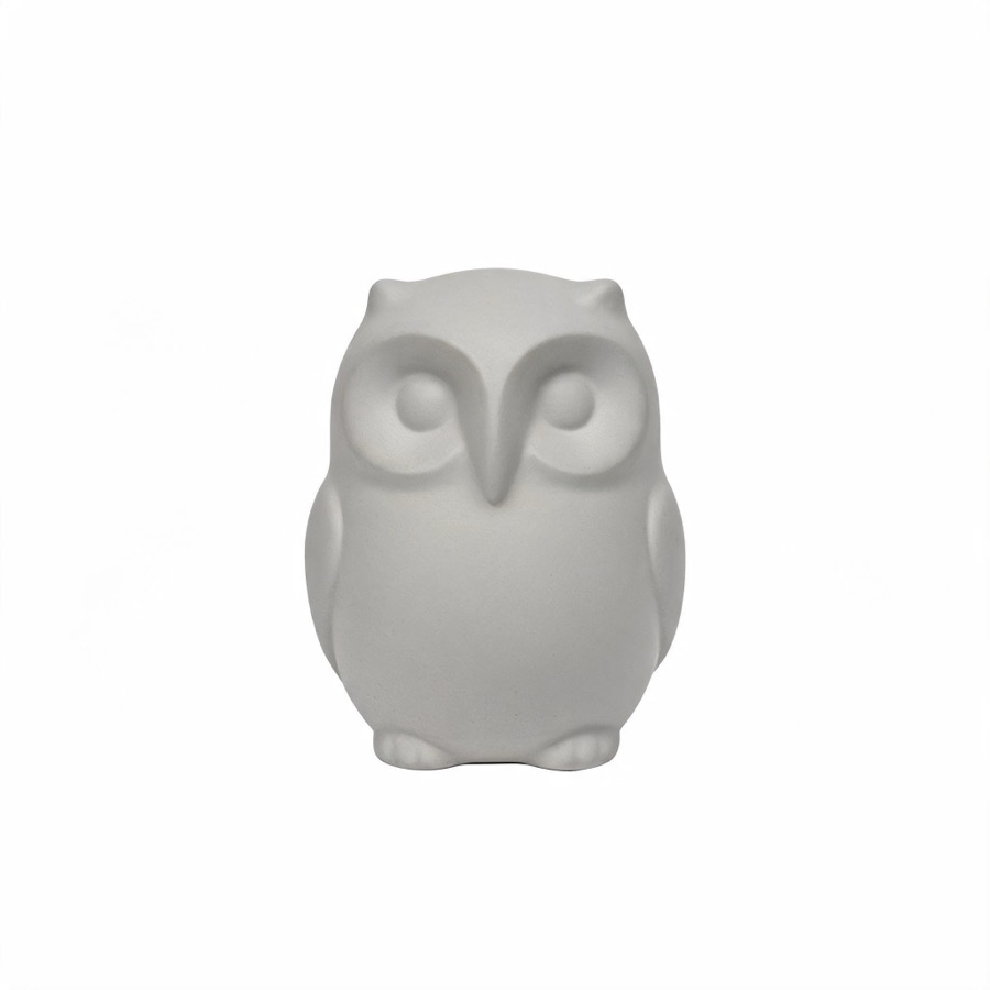 The source image: a small stylised owl figurine in matte pale grey on a plain white background, front view